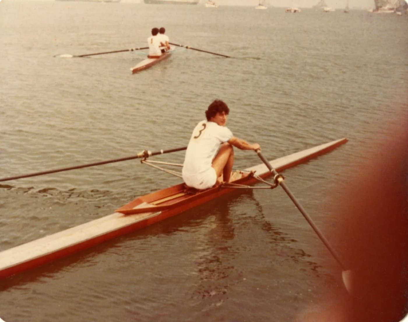 Luis in a wooden scull